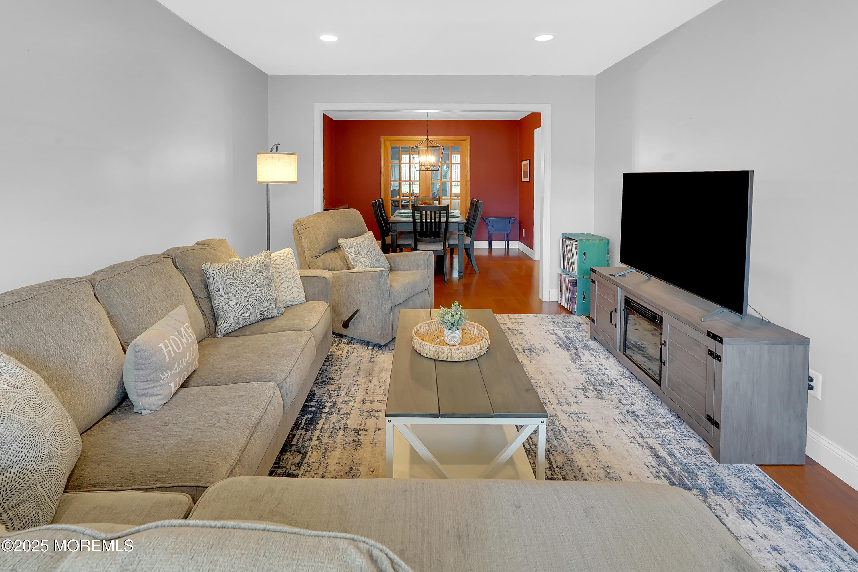 12 Quailtree Lane Howell, NJ 07731 - Photo 7 of 51 a living room with furniture and a flat screen tv