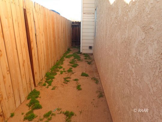 505 East Wilson Avenue Ridgecrest, CA 93555 - Photo 11 of 14 a view of a bathroom with shower curtain