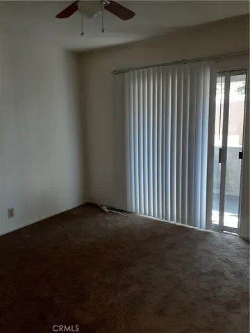 a view of a room that has a large window