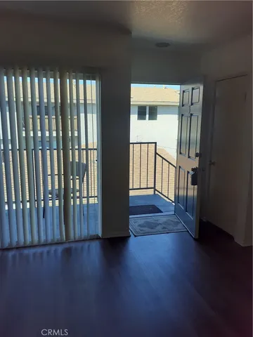 a view of entryway with wooden floor