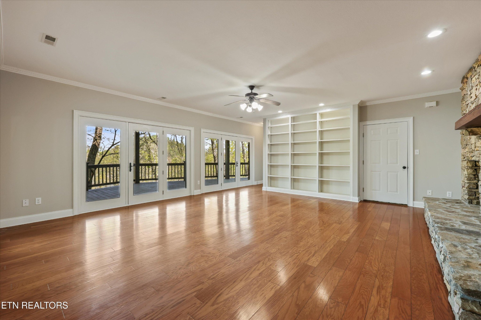 865 Stonegate Way Townsend, TN 37882 - Photo 37 of 60 a view of an empty room with a window and wooden floor