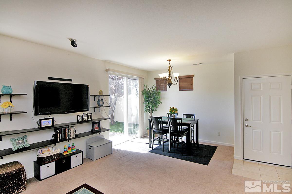 11032 Colton Drive Reno, NV 89521 - Photo 4 of 24 a living room with furniture and a flat screen tv