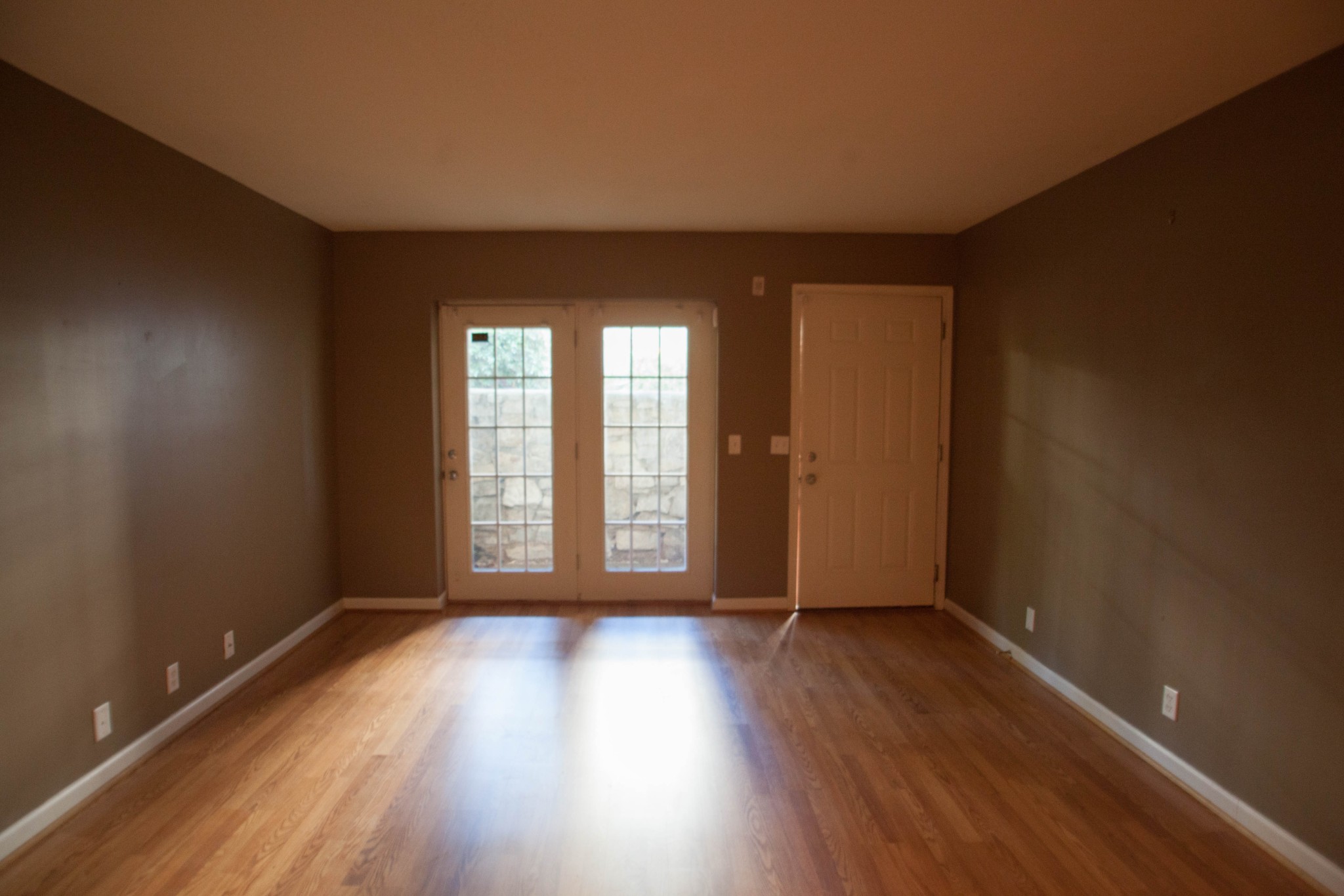420 Elysian Fields Road, Unit E10 Nashville, TN 37211 - Photo 2 of 10 a view of an empty room with wooden floor and a window