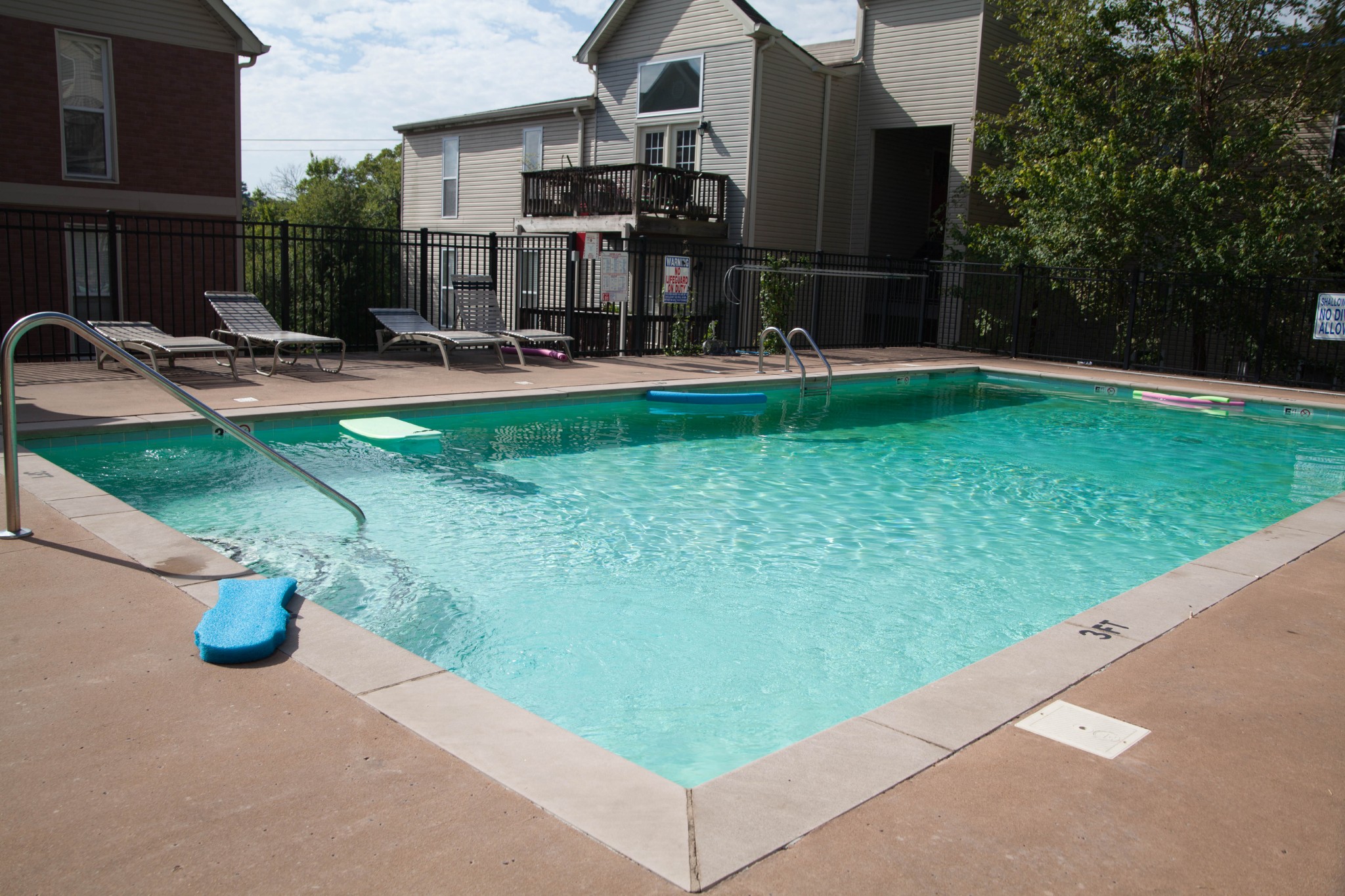 420 Elysian Fields Road, Unit E10 Nashville, TN 37211 - Photo 10 of 10 a view of a patio with table and chairs and a fire pit