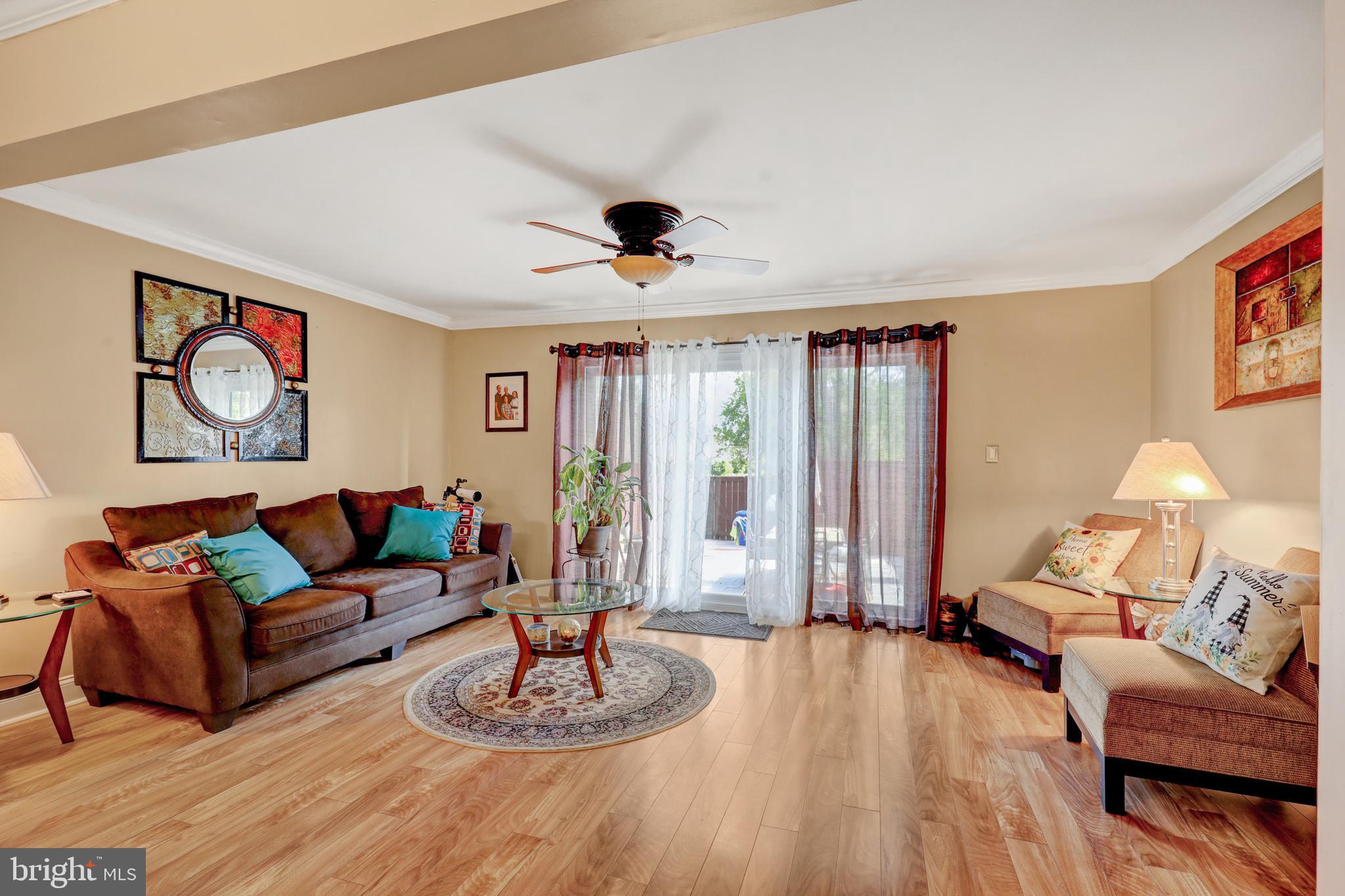 369 Bolton Road Hightstown, NJ 08520 - Photo 9 of 23 Living room with triple sliders to paver patio...