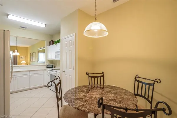 a very nice looking dining room with a table and chairs
