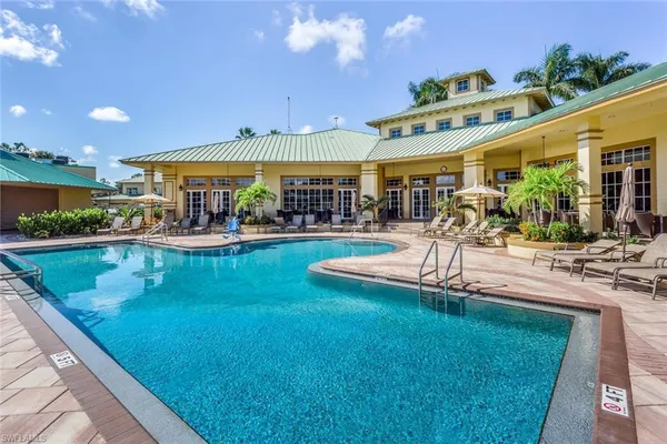 a view of a swimming pool with a patio