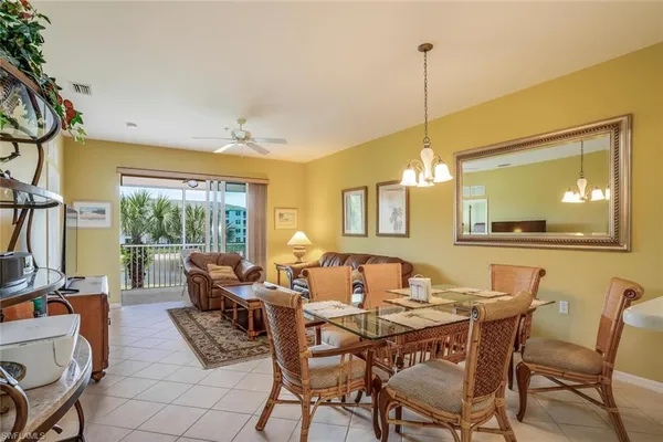 a dining room with furniture and window