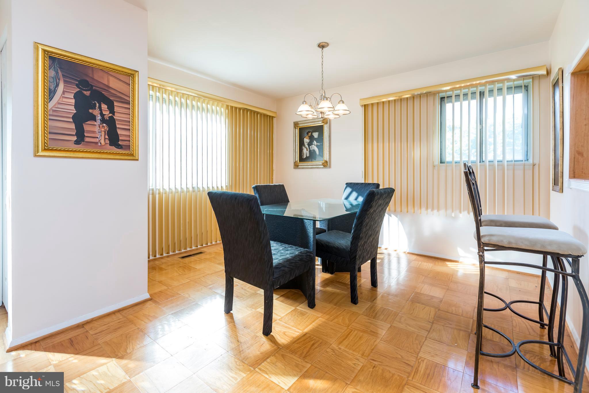 3937 Setonhurst Road Baltimore, MD 21208 - Photo 2 of 29 a view of a dining room with furniture and a window