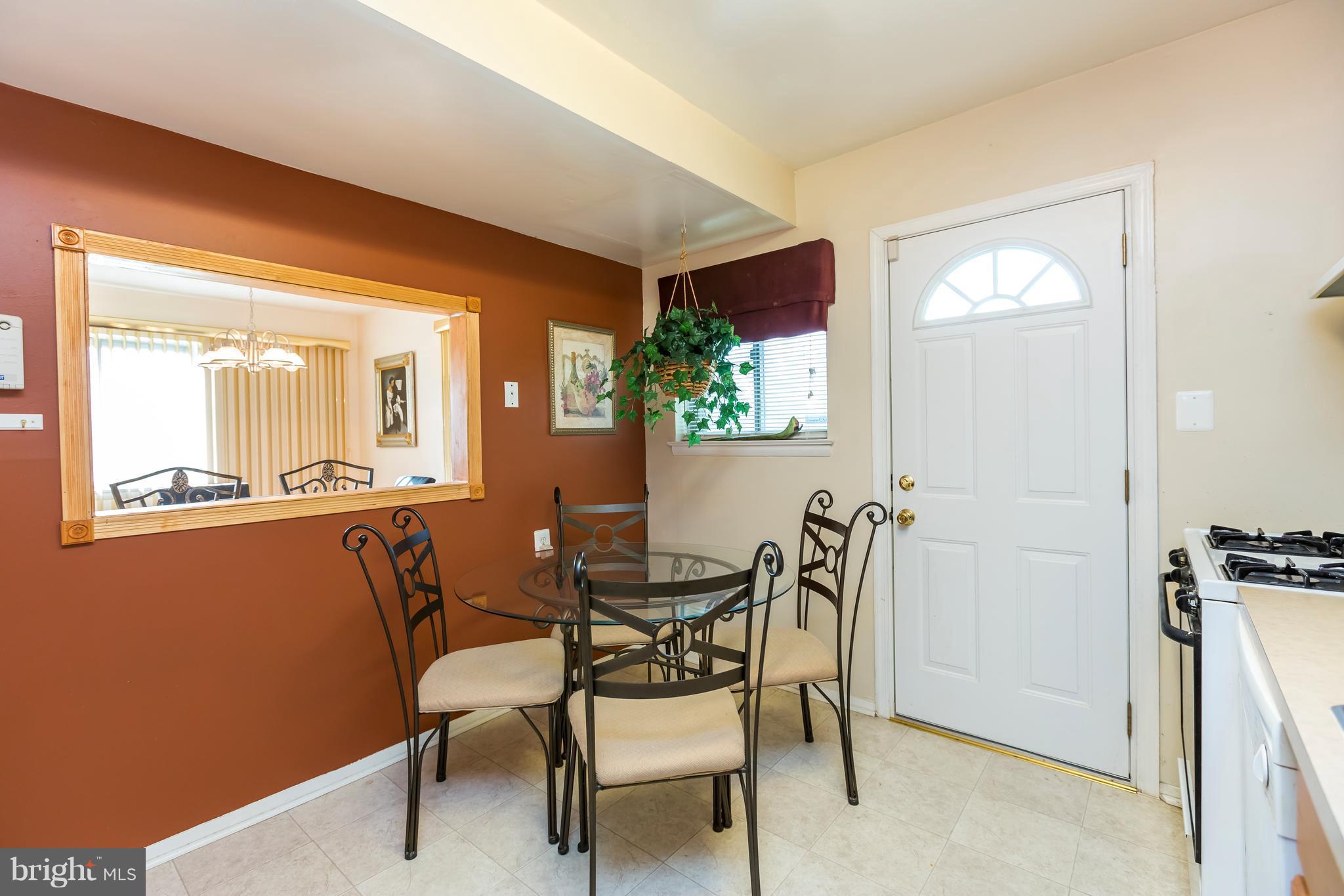 3937 Setonhurst Road Baltimore, MD 21208 - Photo 12 of 29 a dining room with furniture and window