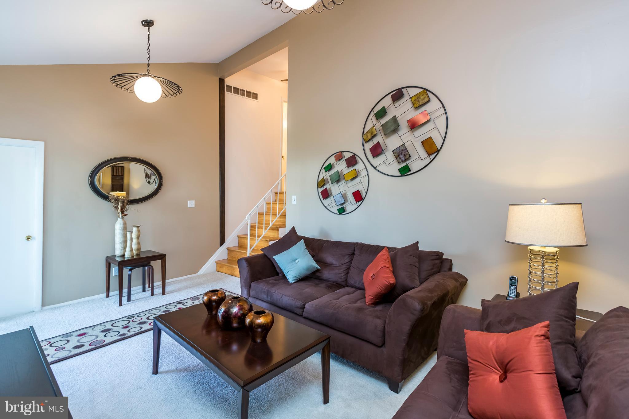 3937 Setonhurst Road Baltimore, MD 21208 - Photo 17 of 29 a living room with furniture and a rug