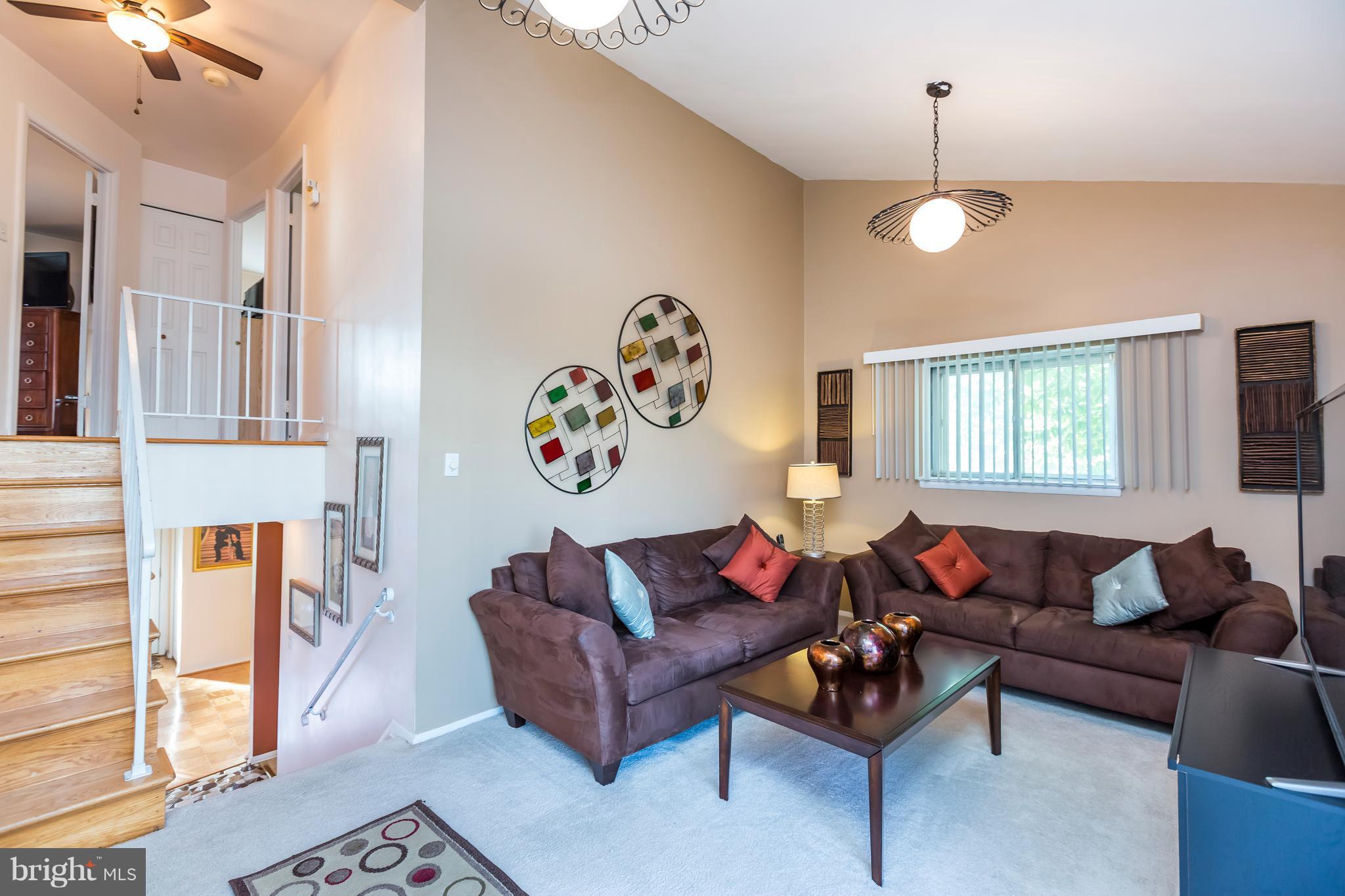 3937 Setonhurst Road Baltimore, MD 21208 - Photo 19 of 29 a living room with furniture and a window