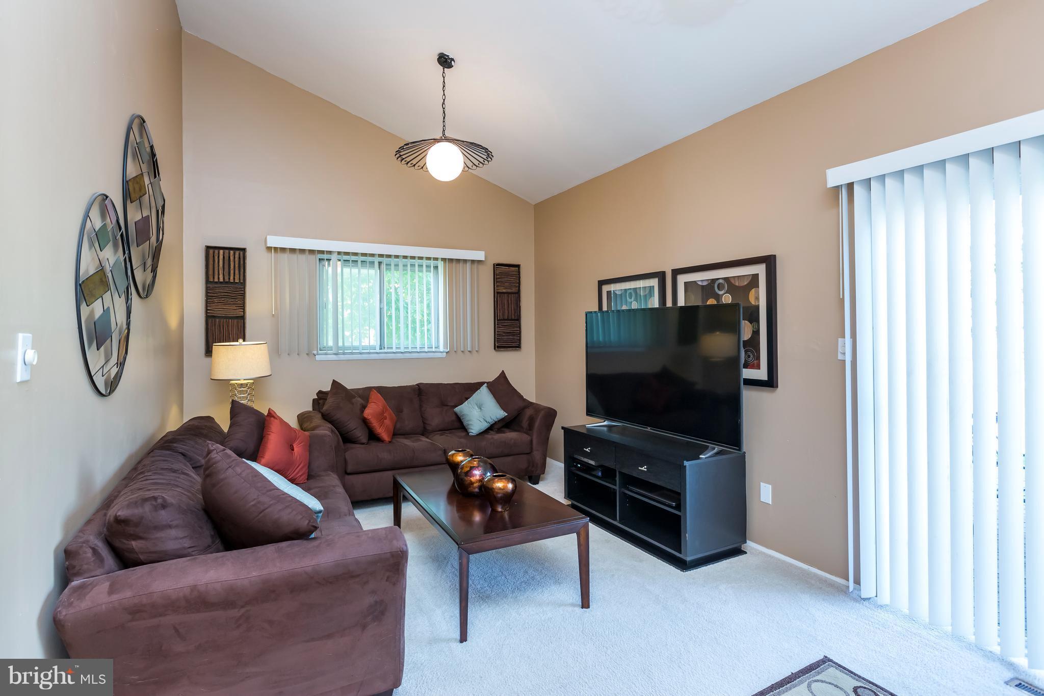 3937 Setonhurst Road Baltimore, MD 21208 - Photo 20 of 29 a living room with furniture and a flat screen tv