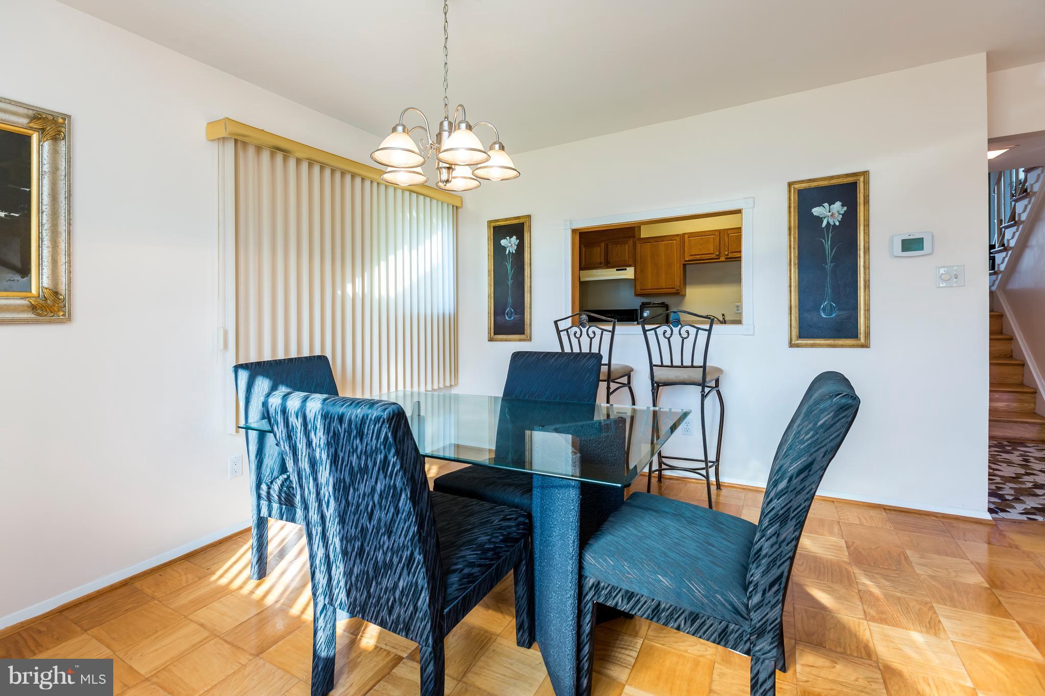 3937 Setonhurst Road Baltimore, MD 21208 - Photo 3 of 29 a view of a dining room with furniture window and wooden floor