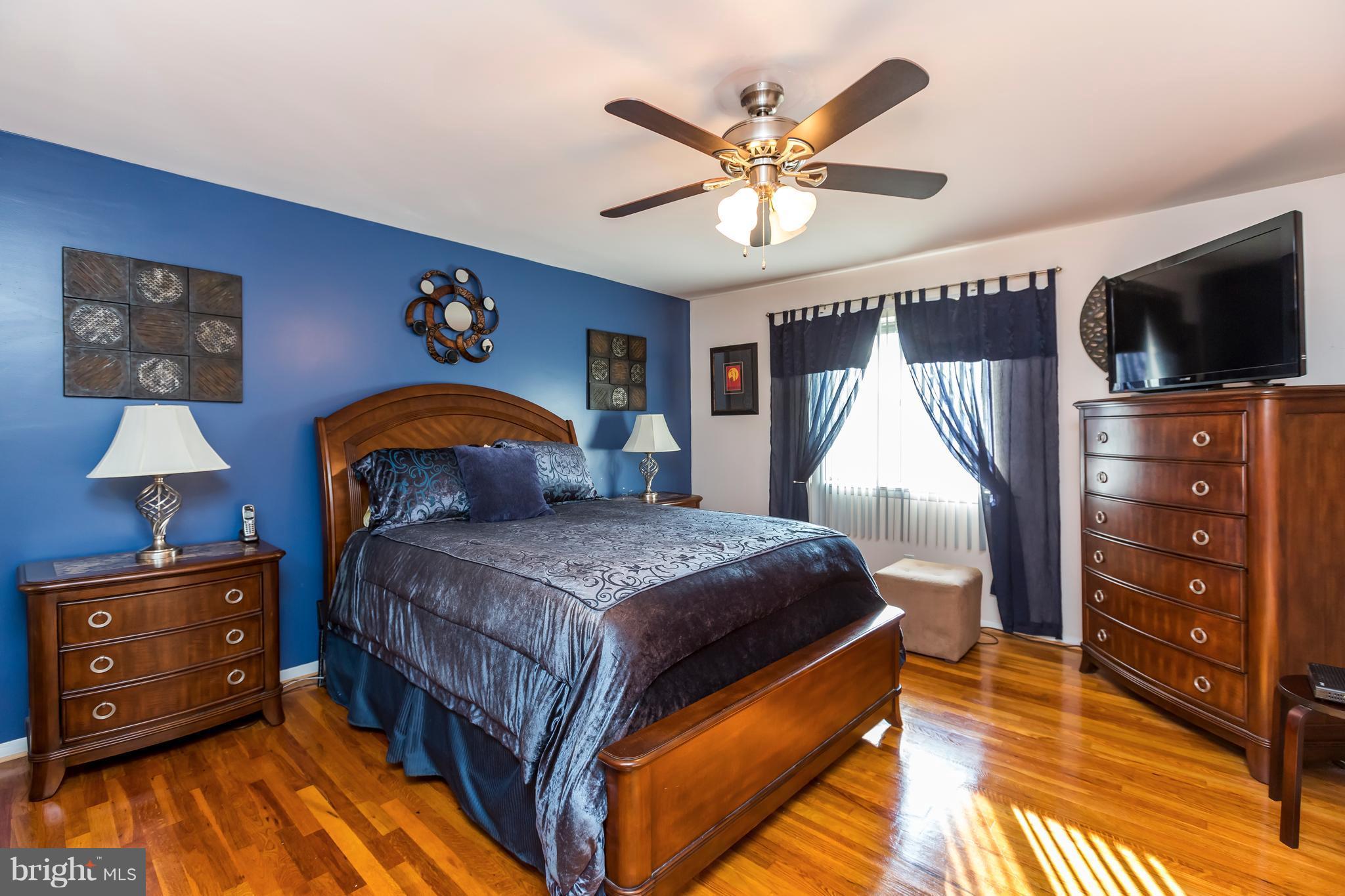 3937 Setonhurst Road Baltimore, MD 21208 - Photo 21 of 29 a bedroom with a bed and a flat screen tv