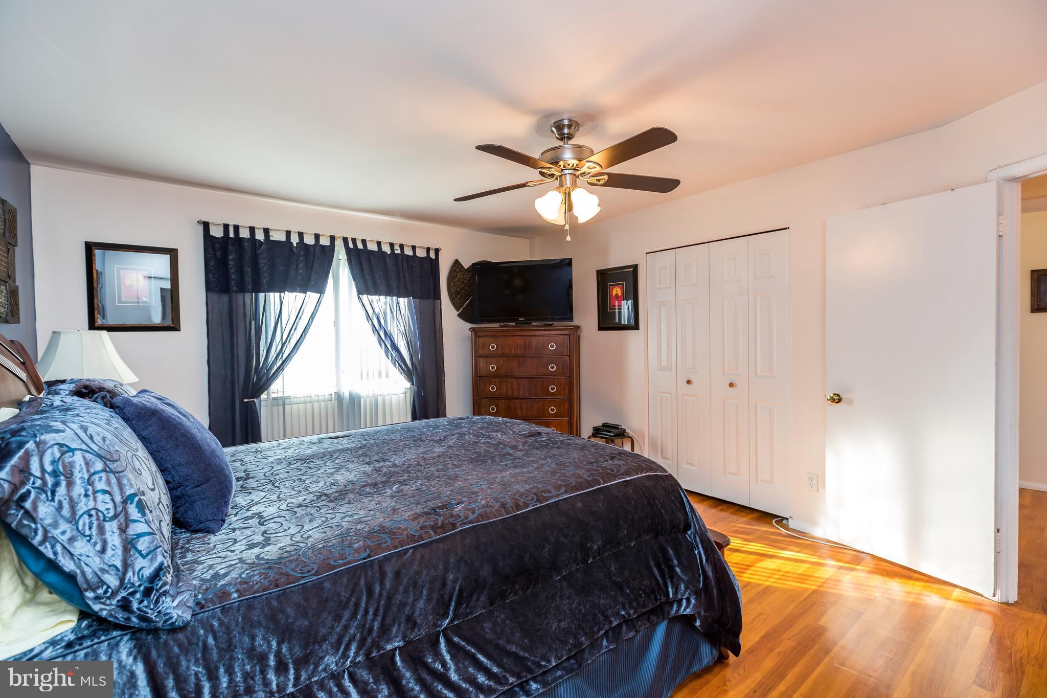 3937 Setonhurst Road Baltimore, MD 21208 - Photo 22 of 29 a bedroom with a bed closet and a window