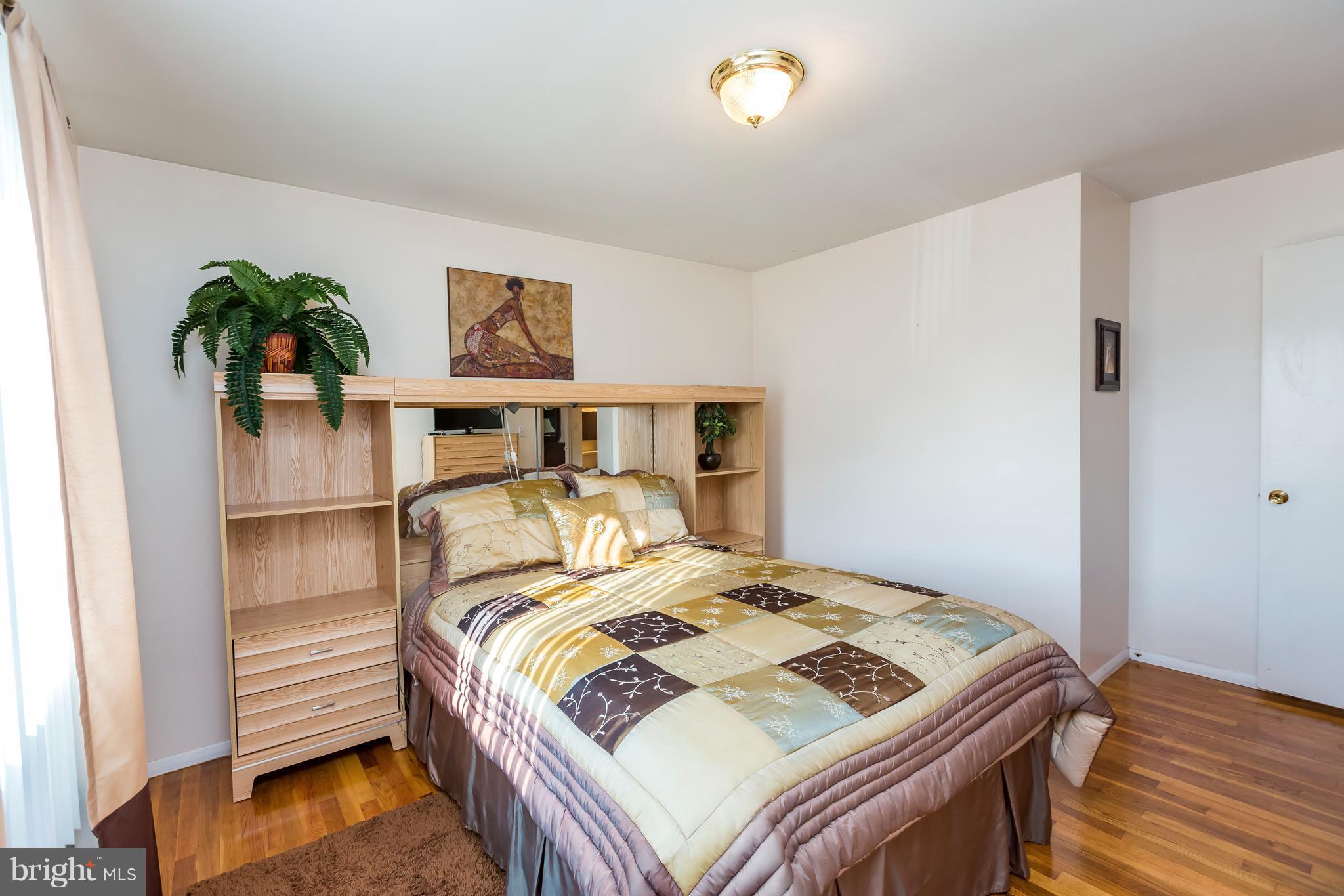3937 Setonhurst Road Baltimore, MD 21208 - Photo 24 of 29 a bedroom with a bed and painting on the wall