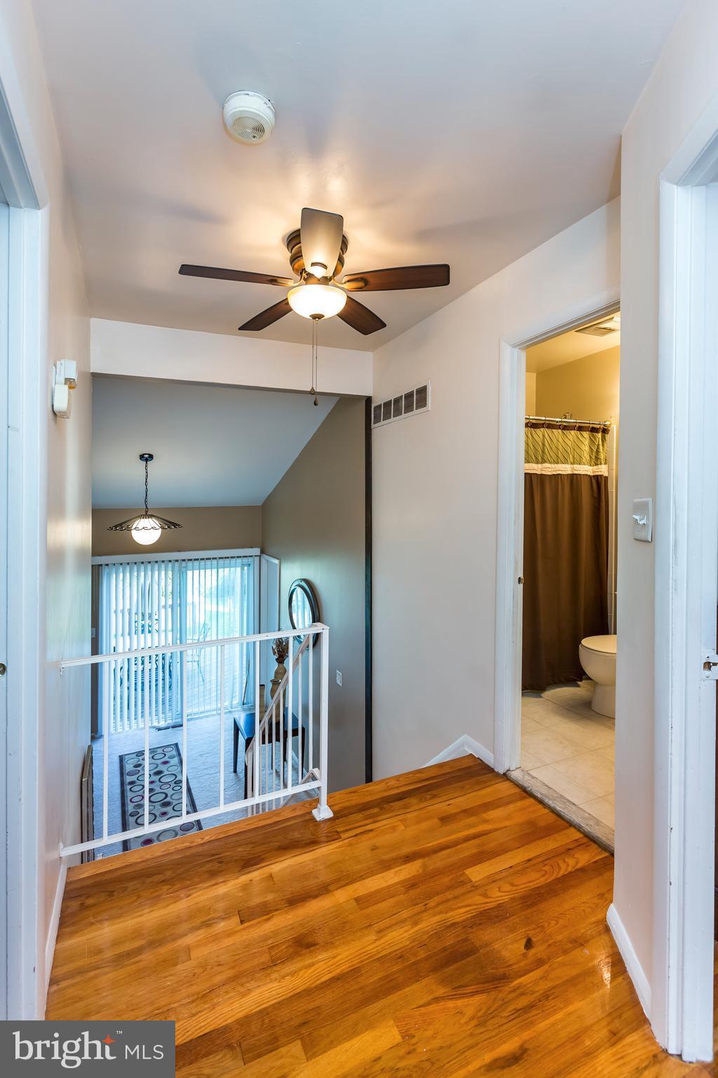 3937 Setonhurst Road Baltimore, MD 21208 - Photo 25 of 29 a bedroom with a large bed and a chandelier