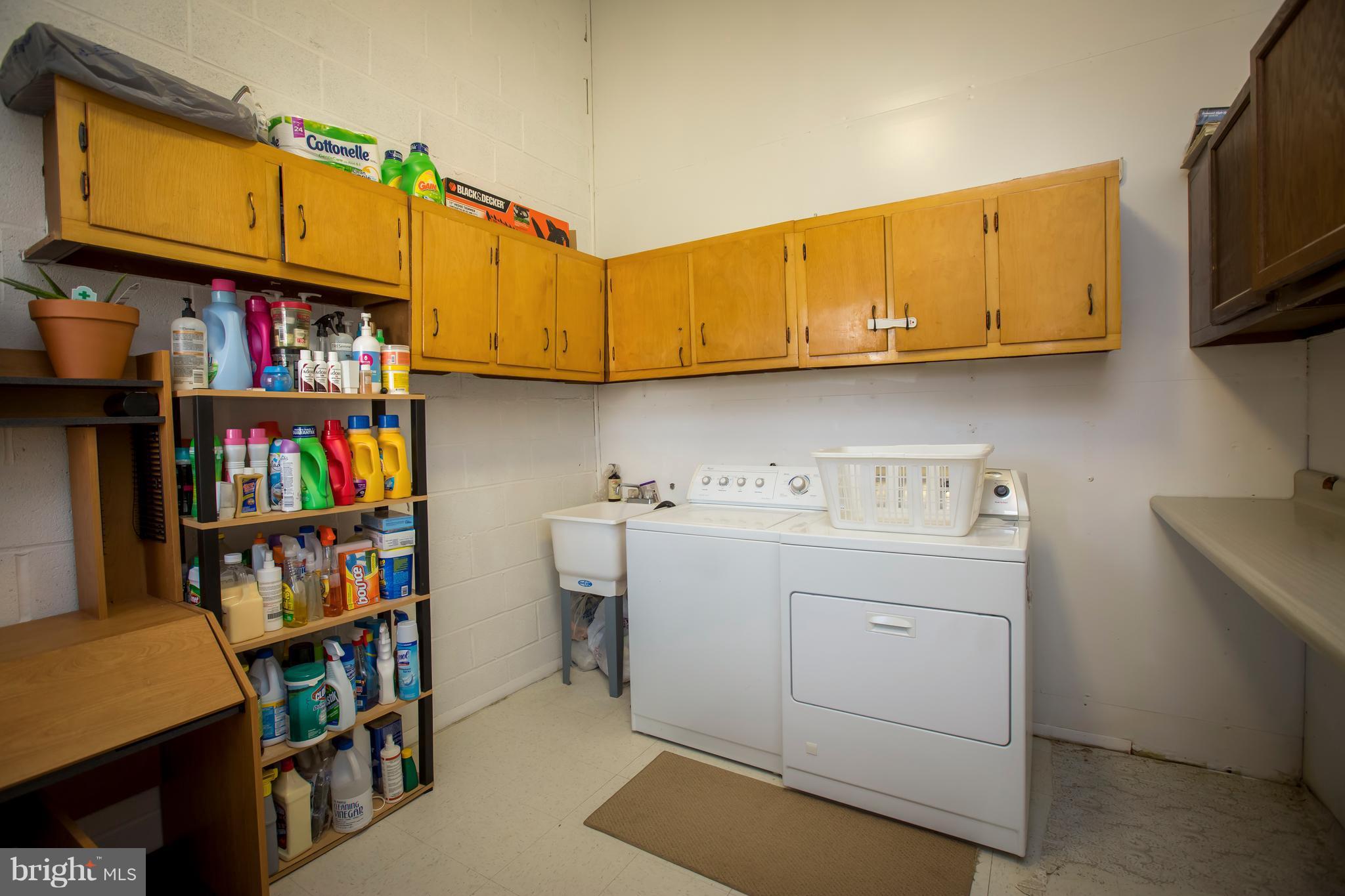 3937 Setonhurst Road Baltimore, MD 21208 - Photo 28 of 29 a utility room with dryer and washer