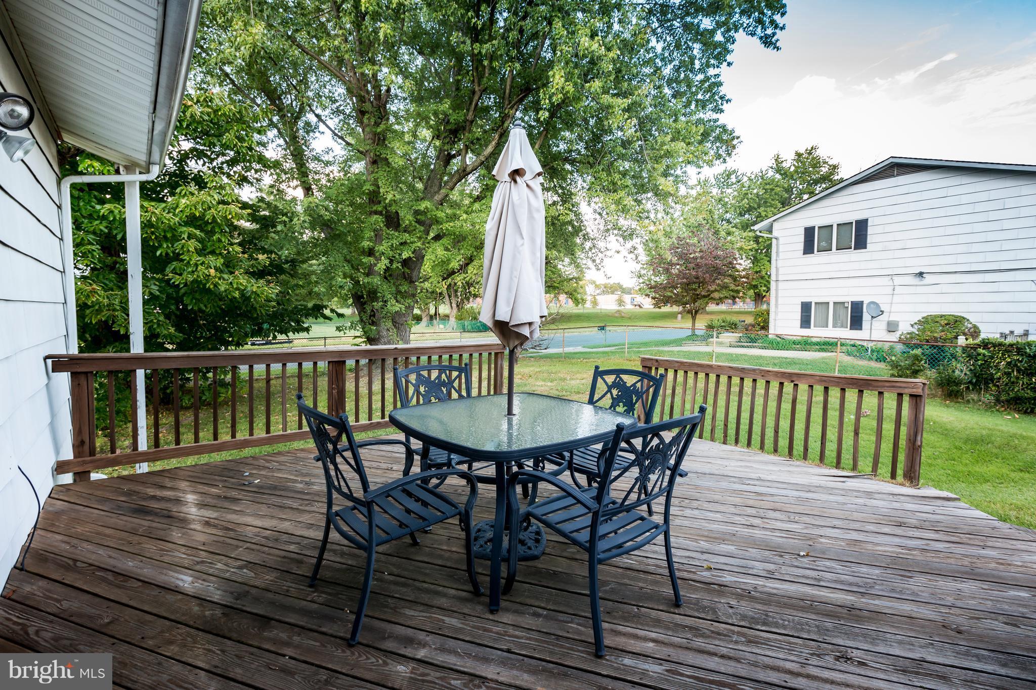 3937 Setonhurst Road Baltimore, MD 21208 - Photo 29 of 29 a view of a deck with furniture and wooden deck