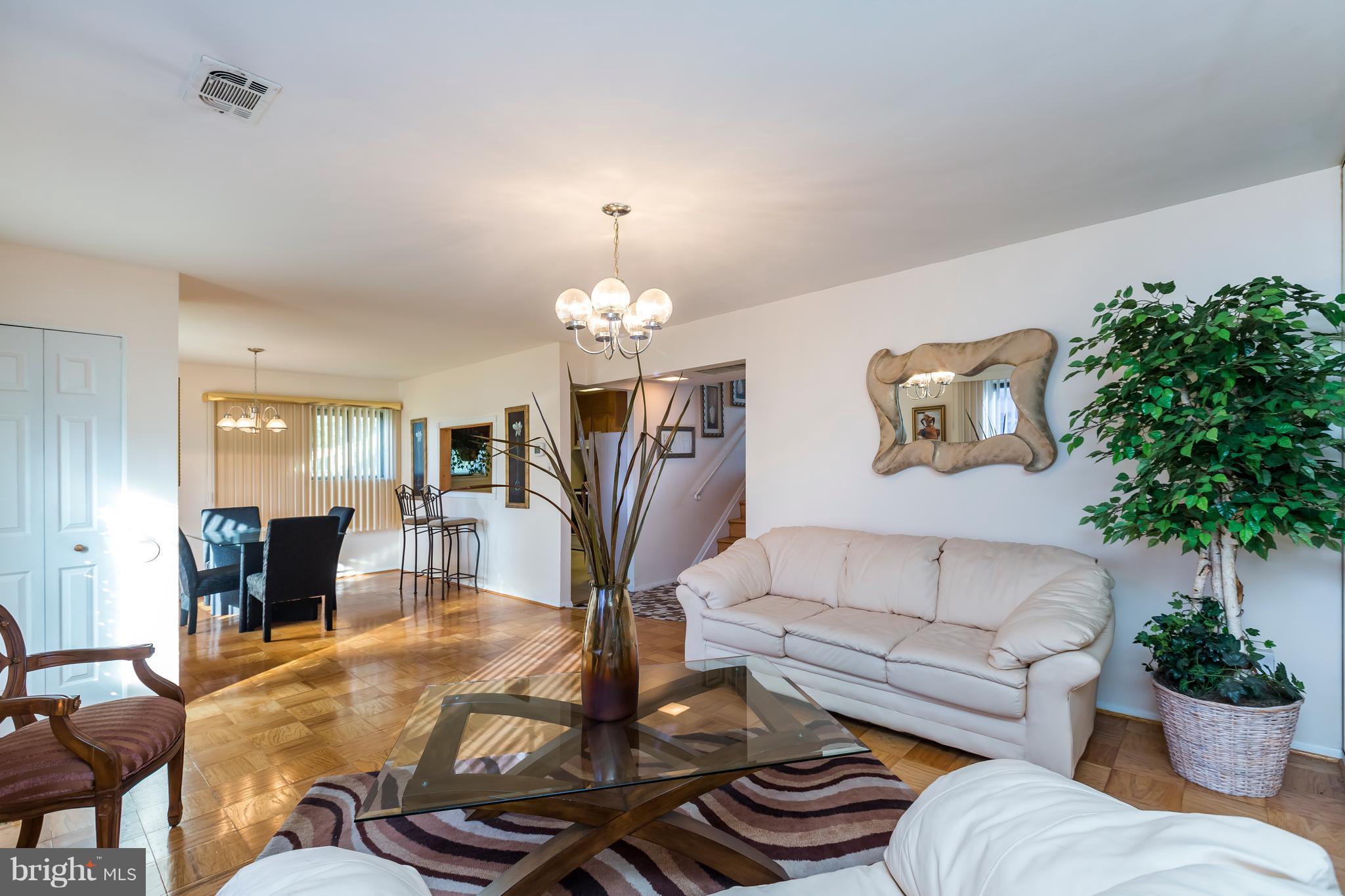 3937 Setonhurst Road Baltimore, MD 21208 - Photo 5 of 29 a living room with furniture fireplace and dining table