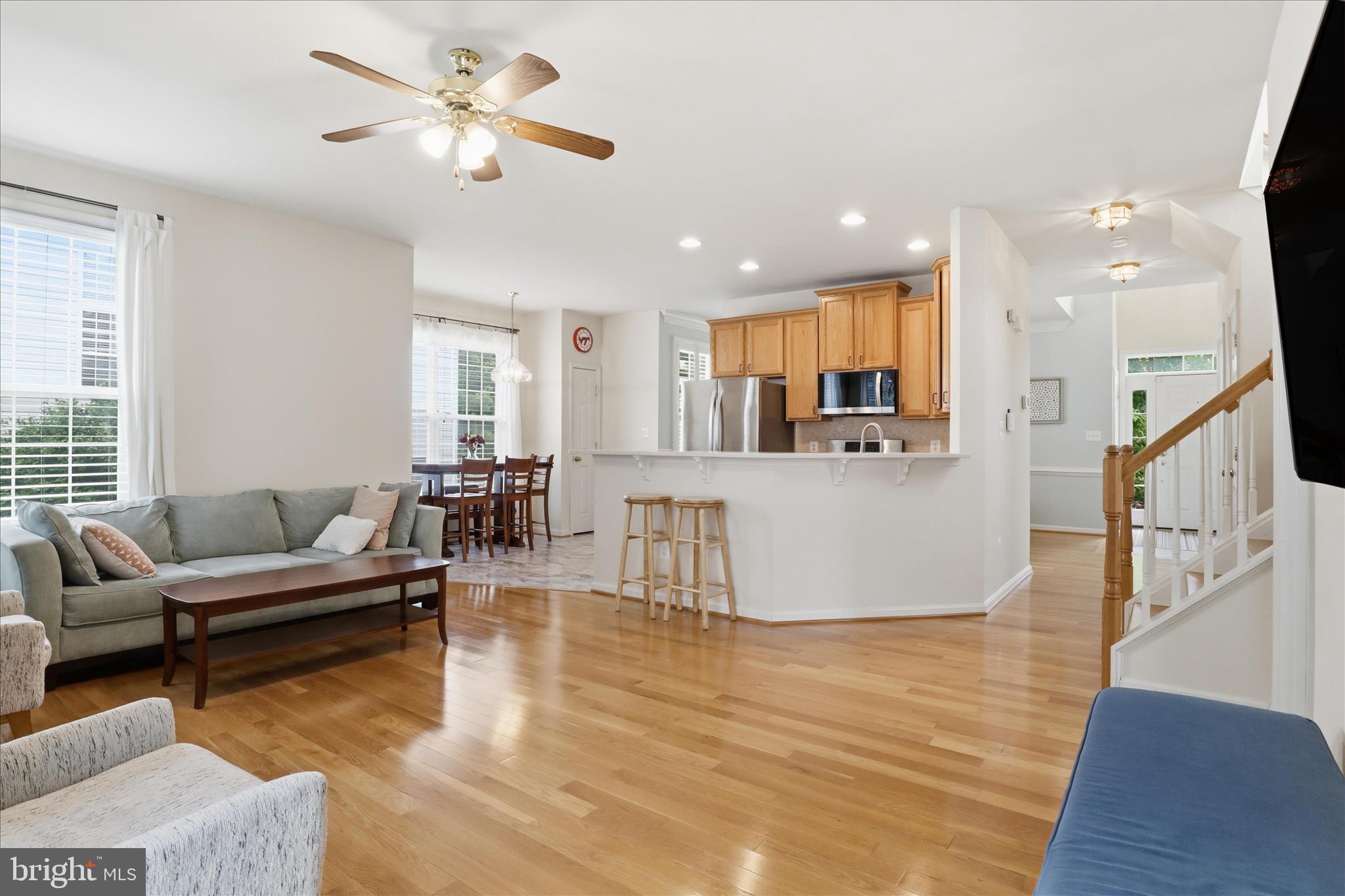 25352 Ripleys Field Drive Chantilly, VA 20152 - Photo 8 of 54 a living room with furniture and kitchen view