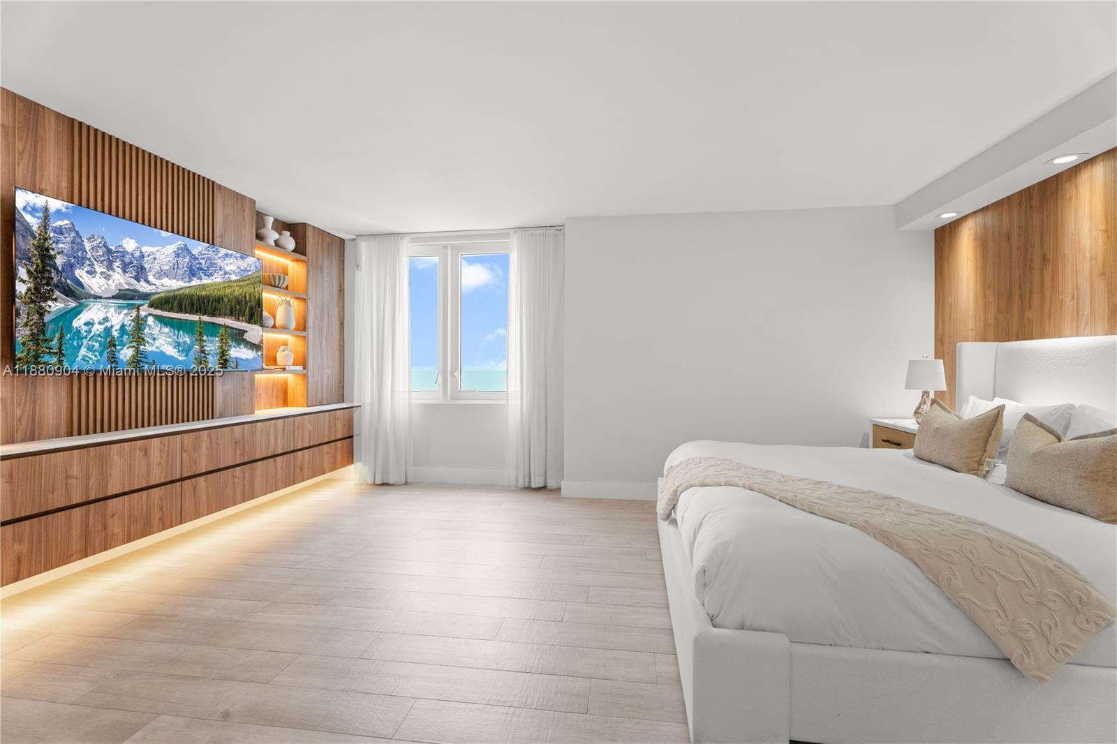 2301 Collins Avenue, Unit 152324 Miami Beach, FL 33139 - Photo 13 of 26 a bed room with a bed and a large window