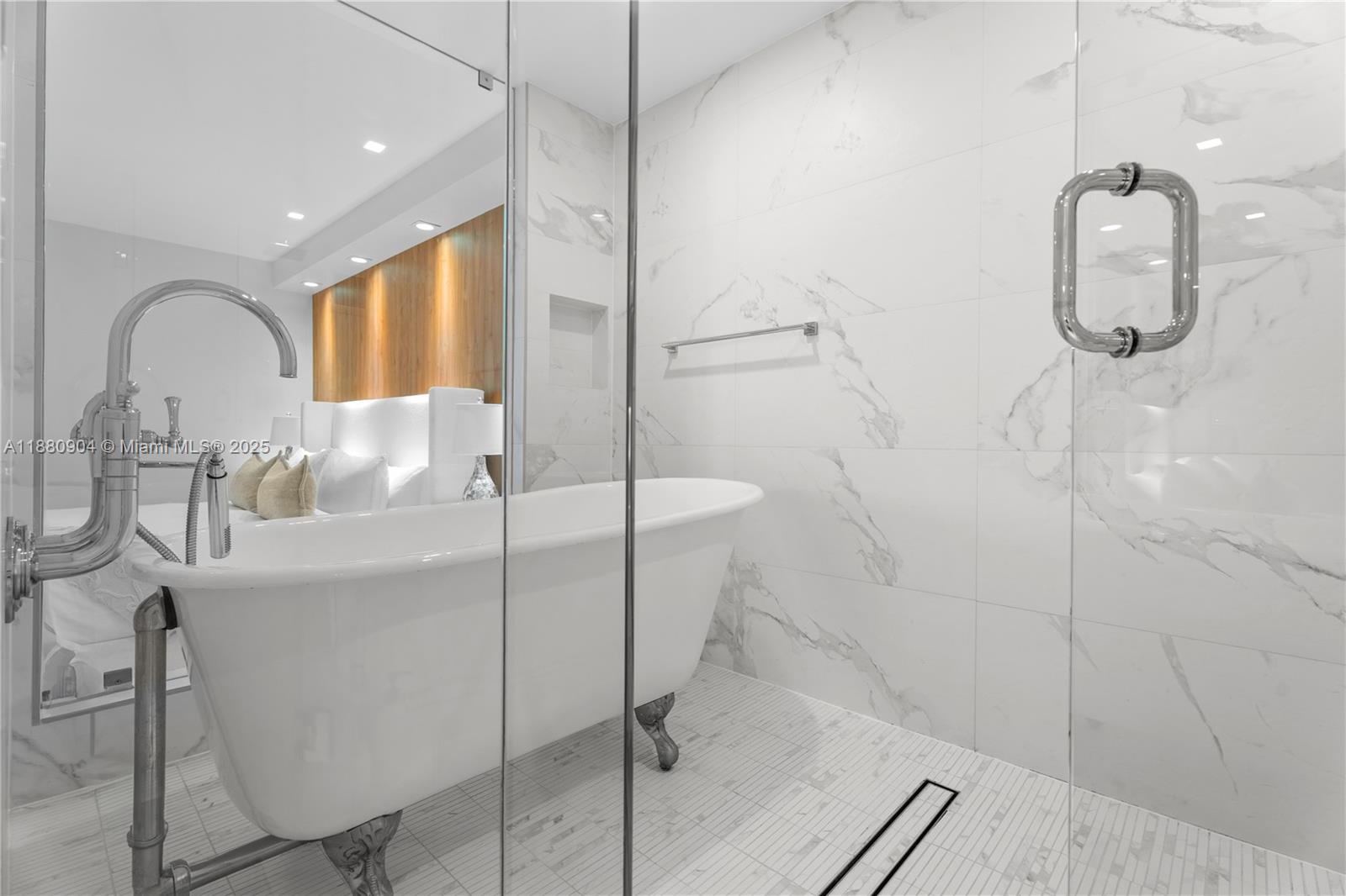 2301 Collins Avenue, Unit 152324 Miami Beach, FL 33139 - Photo 15 of 26 a bathroom with a sink and mirror