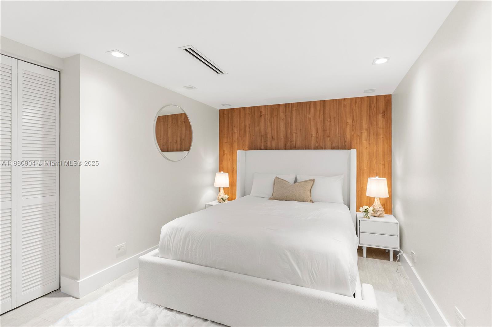 2301 Collins Avenue, Unit 152324 Miami Beach, FL 33139 - Photo 16 of 26 a bedroom with a bed and a window