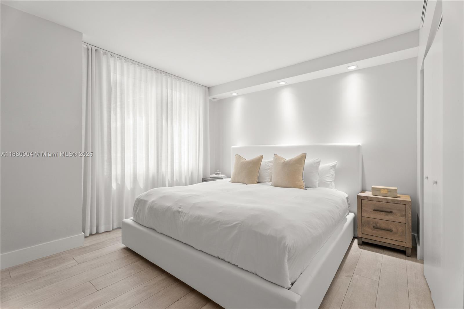 2301 Collins Avenue, Unit 152324 Miami Beach, FL 33139 - Photo 7 of 26 a bedroom with a bed and a night stand