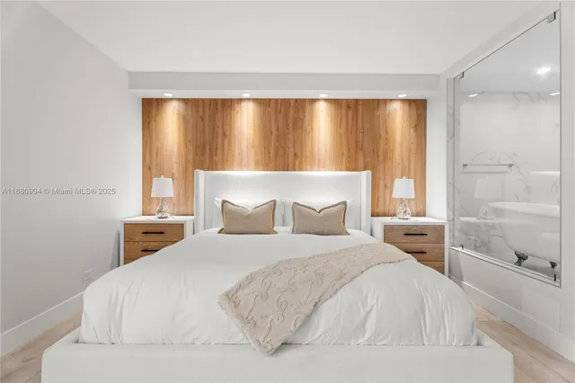 a bedroom with a large bed and a large window