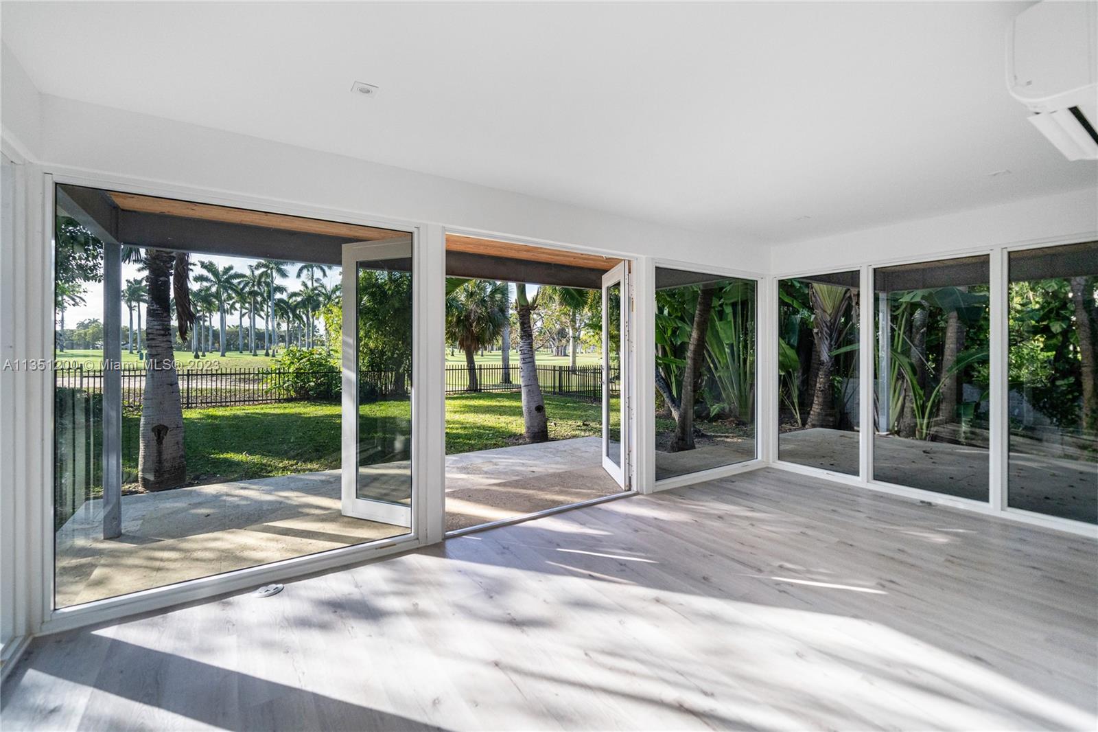 5512 La Gorce Drive Miami Beach, FL 33140 - Photo 18 of 35 a view of backyard with floor to ceiling window