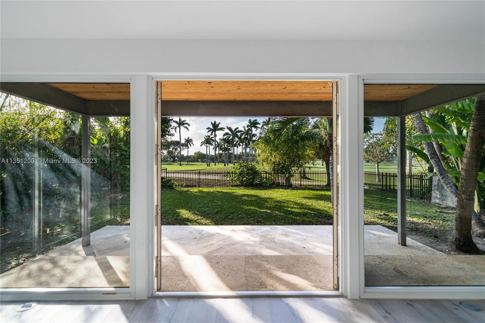 5512 La Gorce Drive Miami Beach, FL 33140 - Photo 19 of 35 a view of backyard with large tree and plants