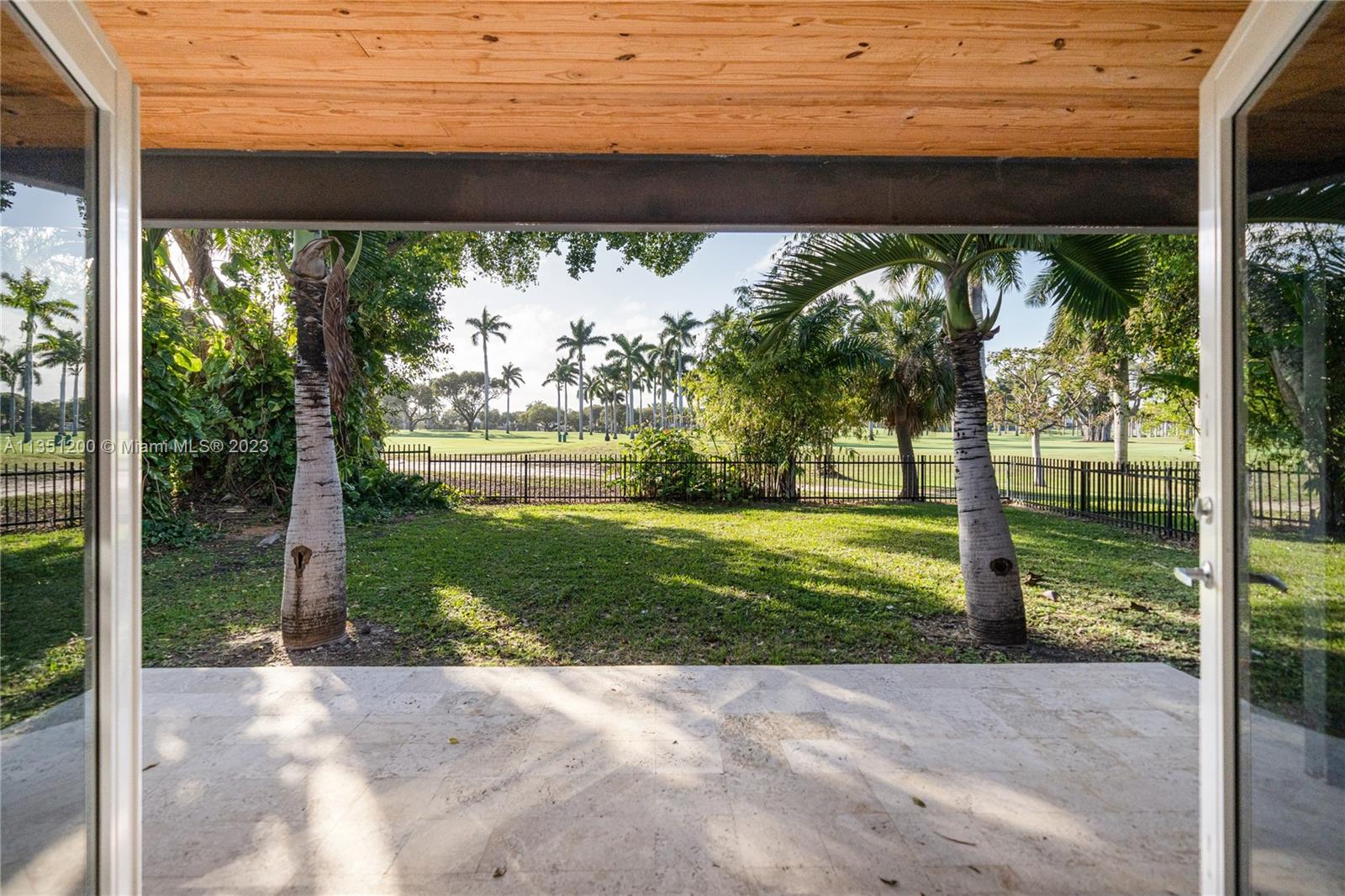5512 La Gorce Drive Miami Beach, FL 33140 - Photo 20 of 35 a view of a porch with a yard