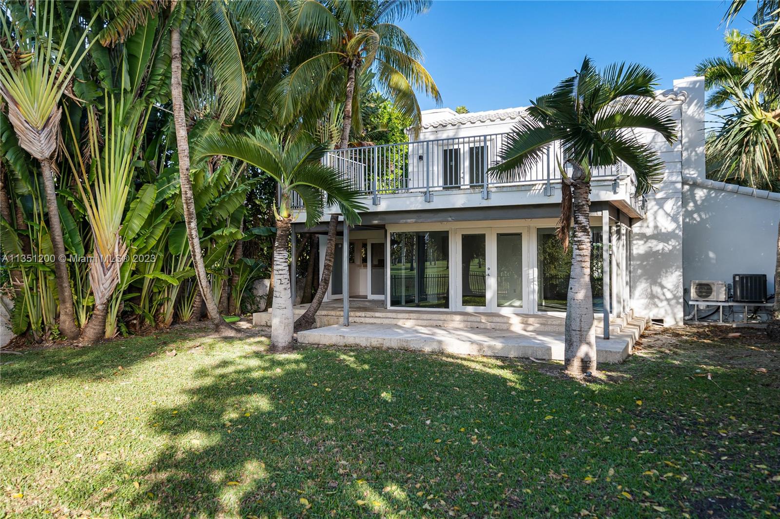 5512 La Gorce Drive Miami Beach, FL 33140 - Photo 24 of 35 a view of a house with a yard