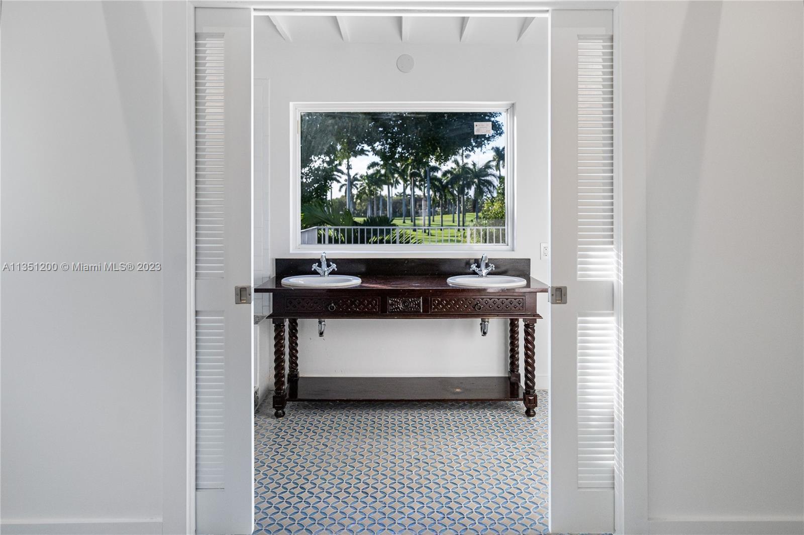 5512 La Gorce Drive Miami Beach, FL 33140 - Photo 32 of 35 a view of living room with furniture and a fireplace