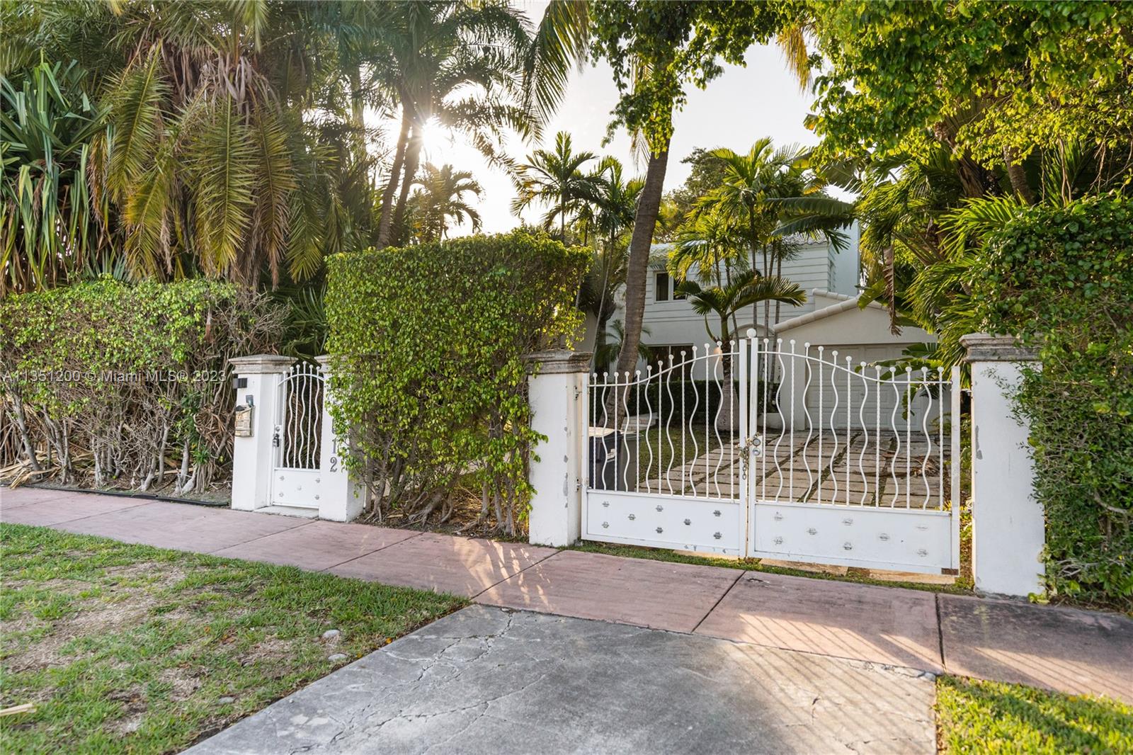 5512 La Gorce Drive Miami Beach, FL 33140 - Photo 34 of 35 a view of a yard with plants and large trees