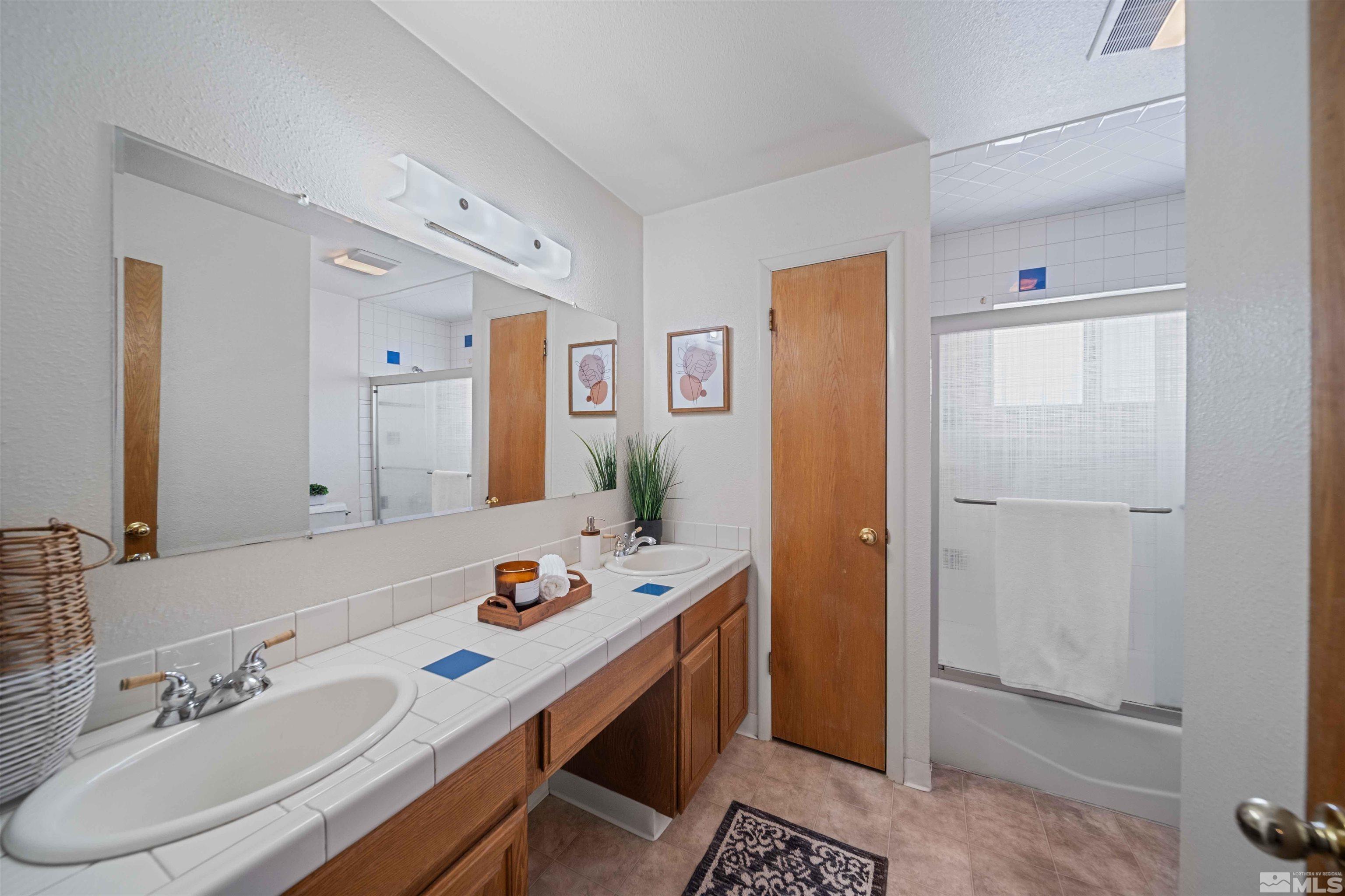 426 Smithridge Drive Reno, NV 89502 - Photo 12 of 20 a spacious bathroom with a double vanity sink mirror and double