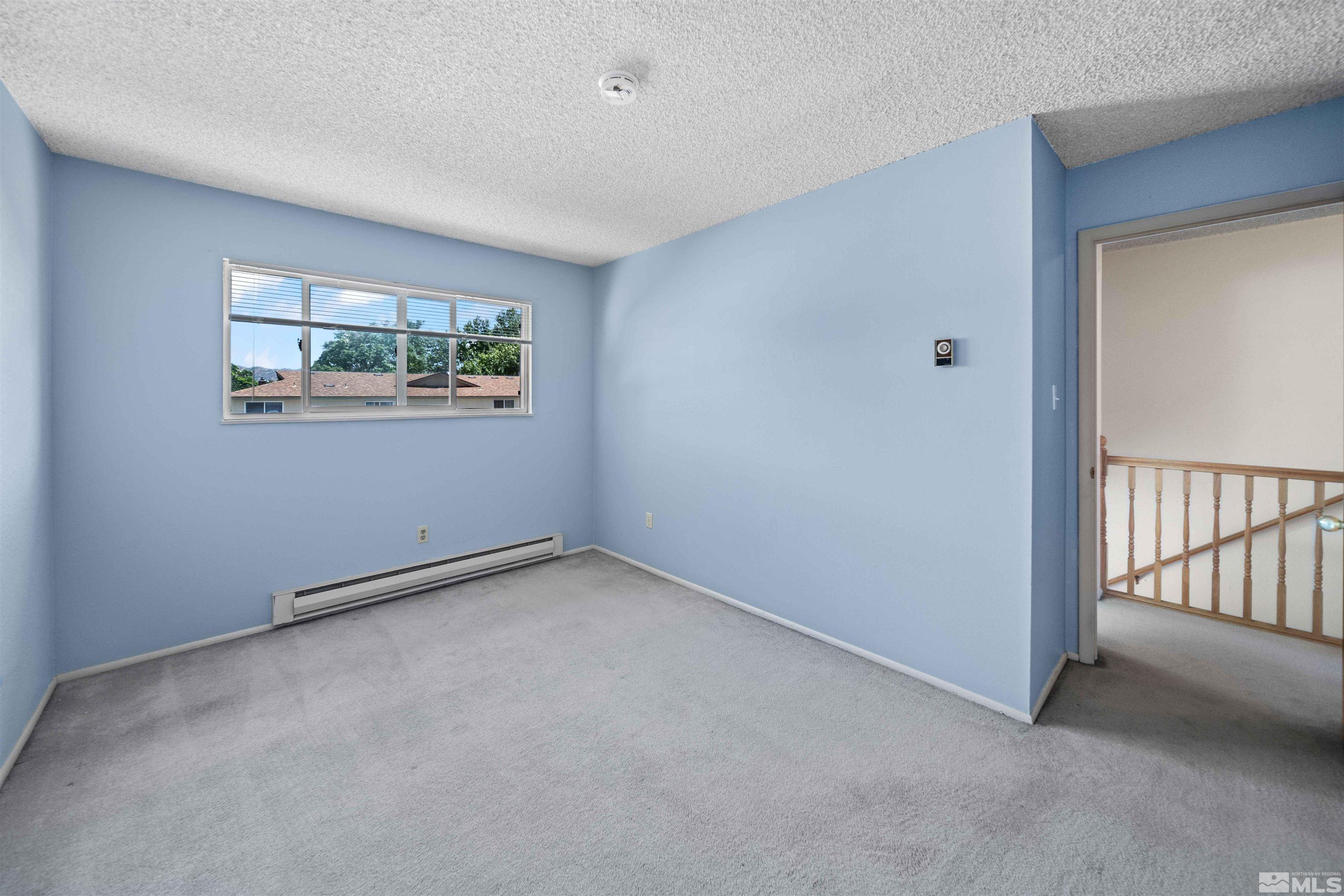 426 Smithridge Drive Reno, NV 89502 - Photo 15 of 20 an empty room with windows