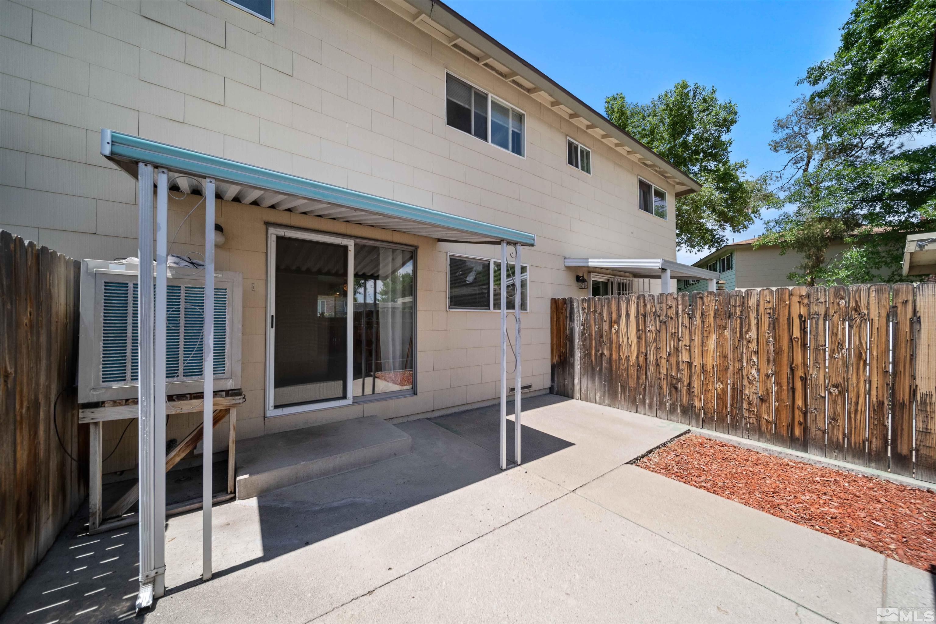 426 Smithridge Drive Reno, NV 89502 - Photo 17 of 20 a backyard of a house with table and chairs