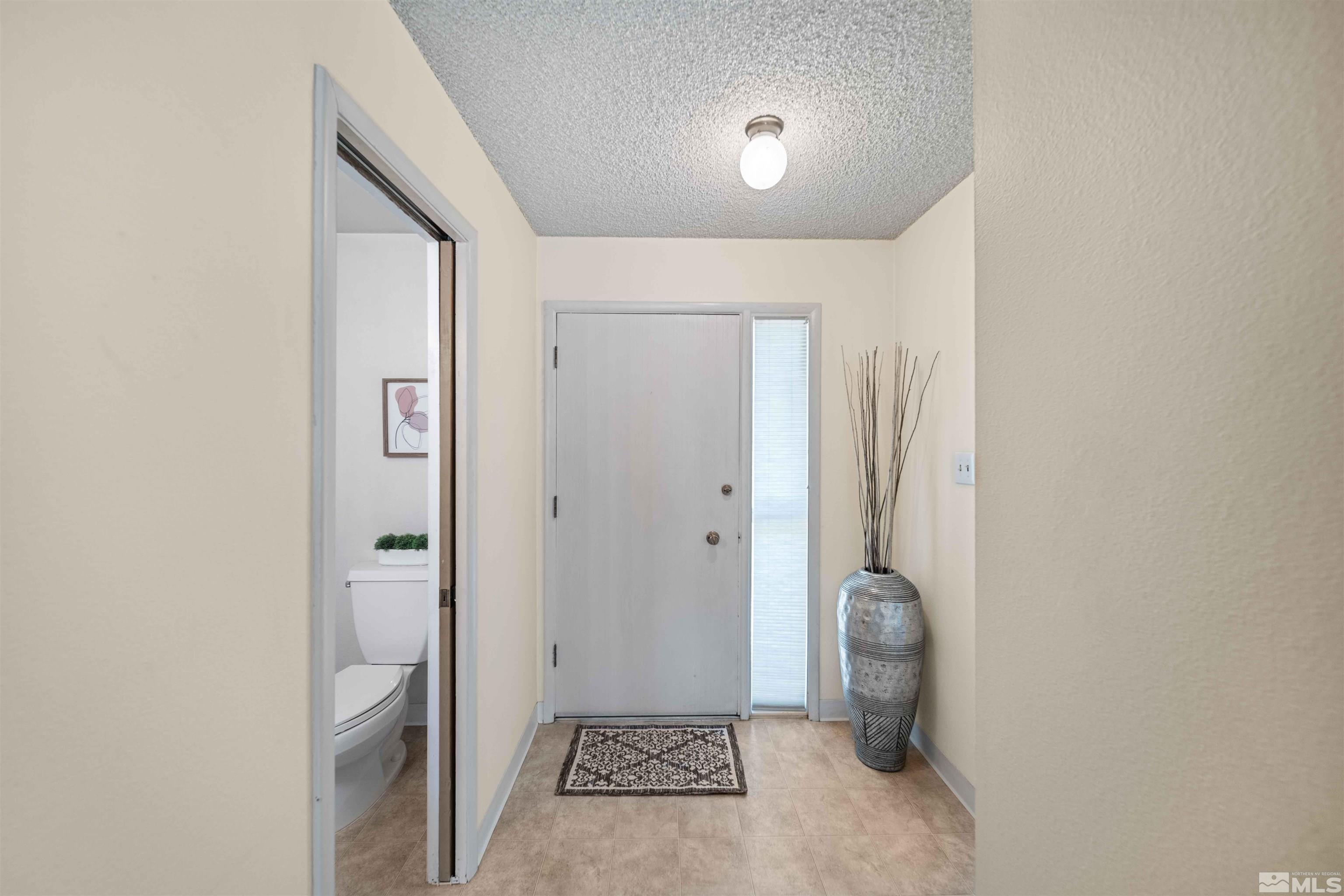 426 Smithridge Drive Reno, NV 89502 - Photo 2 of 20 a bathroom with a shower and a sink
