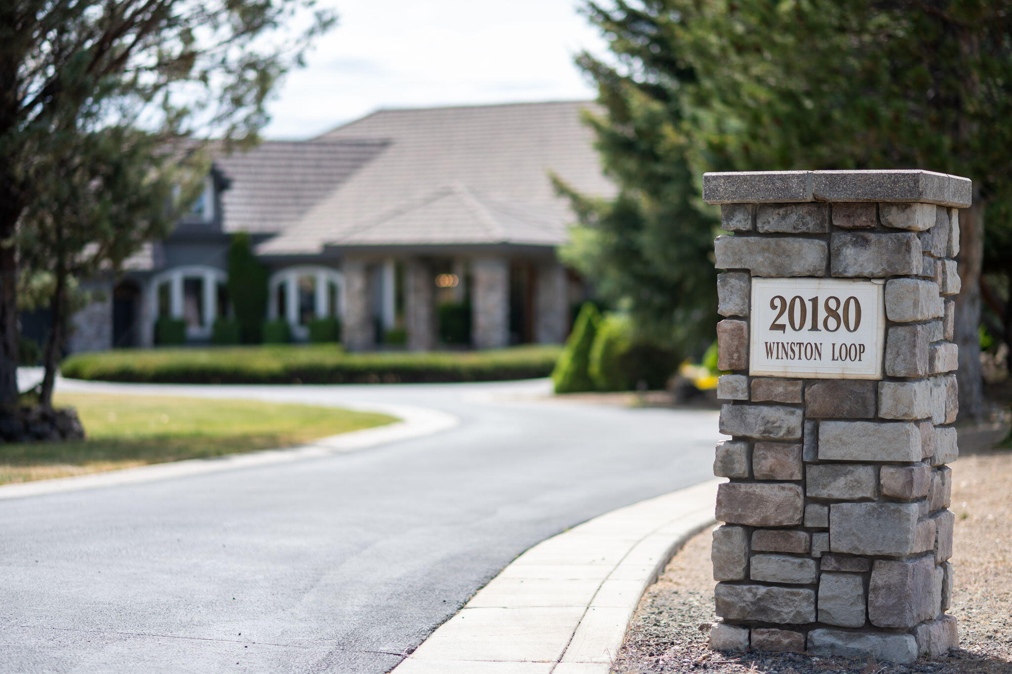 20180 Winston Loop Bend, OR 97703 - Photo 55 of 59 a sign that is on the side of a road
