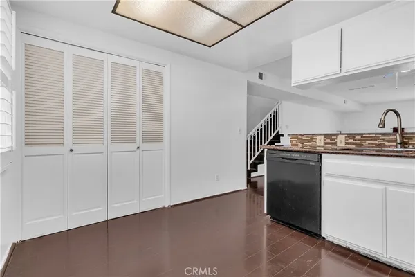 a kitchen with stainless steel appliances granite countertop a stove and a refrigerator