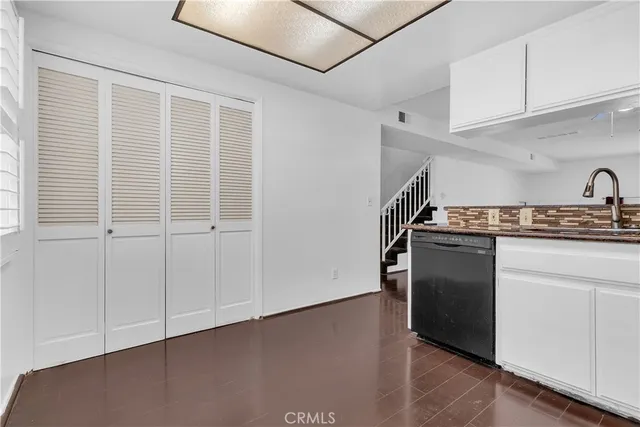 a kitchen with stainless steel appliances granite countertop a stove and a refrigerator