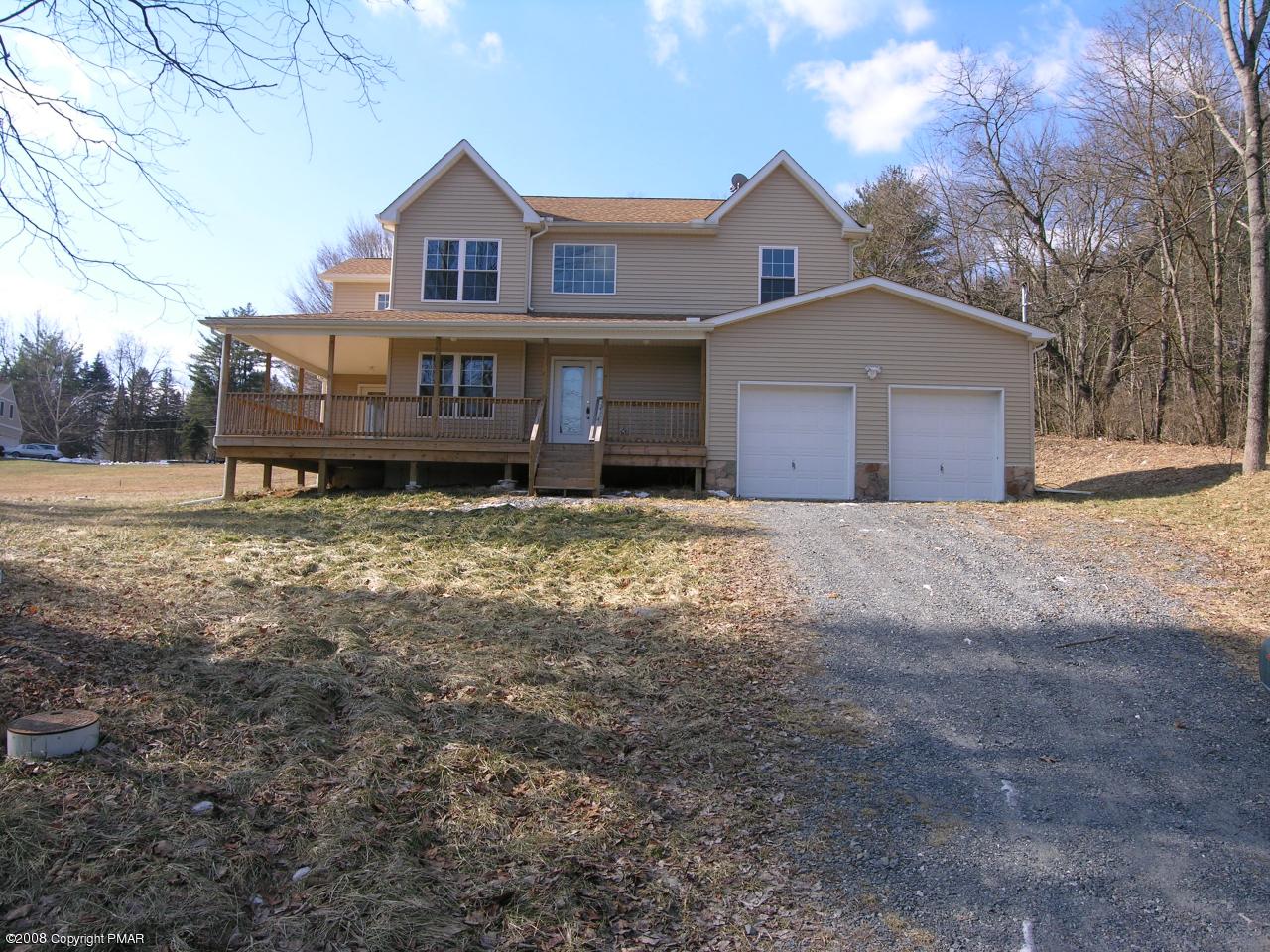 Lot 2 Tanite Road Stroudsburg, PA 18360 - Photo 1 of 1 a front view of a house with a yard and garage