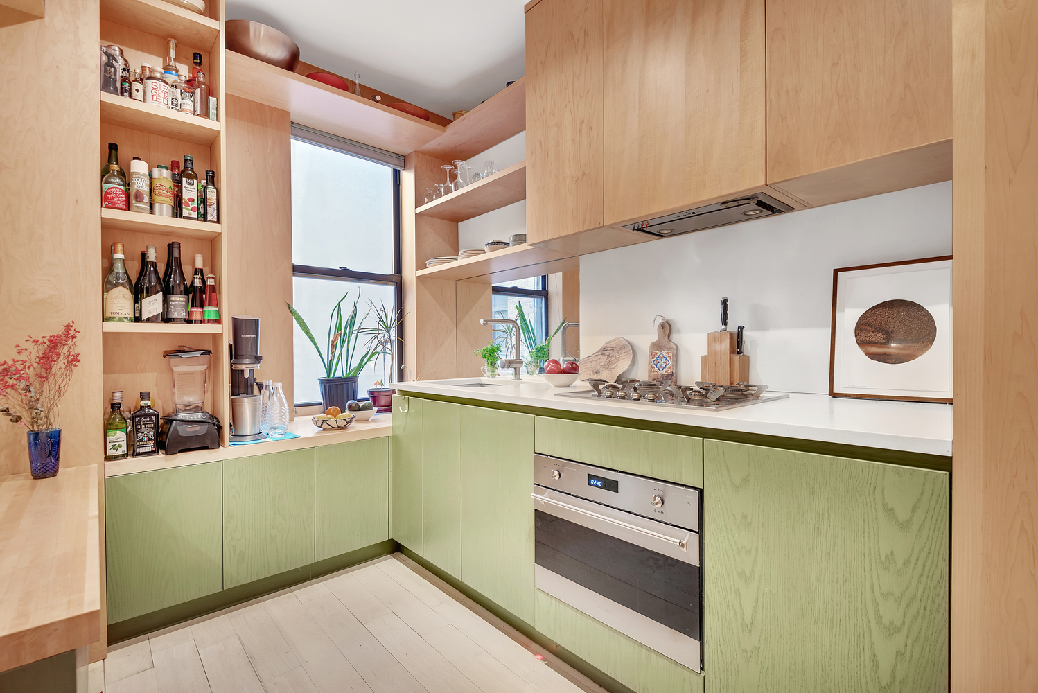 130 West 16th Street, Unit 51 Manhattan, NY 10011 - Photo 3 of 6 a kitchen with cabinets and window