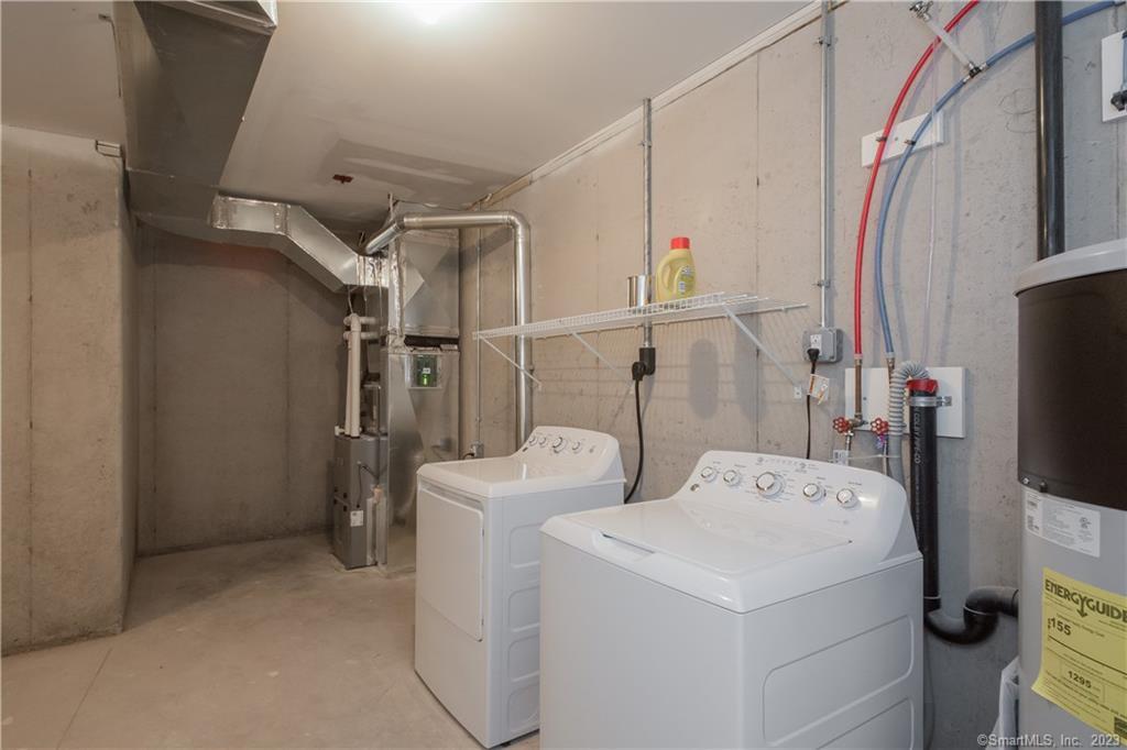 24 Mill Pond Drive, Unit 17 Granby, CT 06035 - Photo 23 of 23 Lower Level Storage with Washer/Dryer