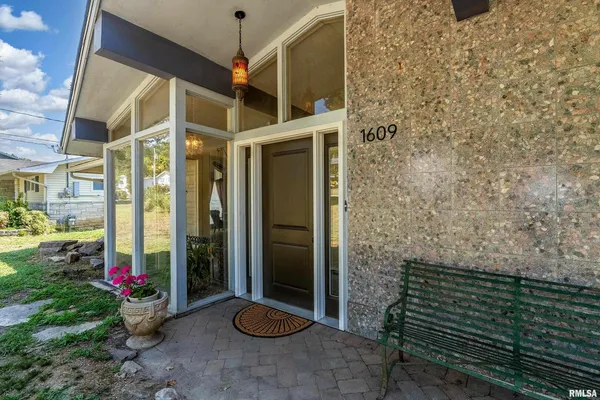 a view of a porch with furniture