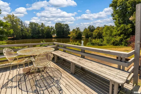 a view of a house with backyard sitting area and porch