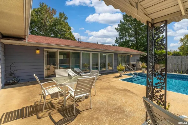 an outdoor space with patio furniture